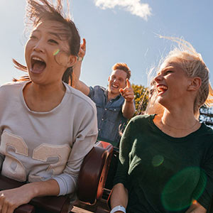 Three friends on a roller coaster.
